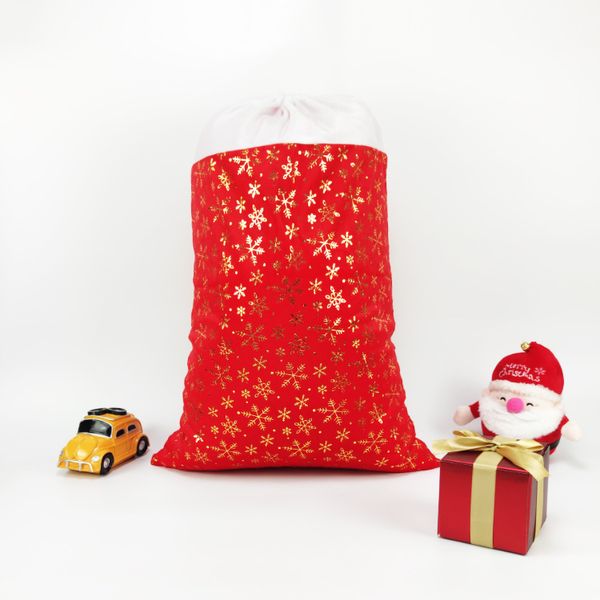 Borse con cordoncino regalo di Natale avvolgere in cotone rosso in cotone rosso stampaggio a caldo riflettente fiocco di neve girare borse di imballaggio sacchetti di natale sacchetto di canvas di cotone