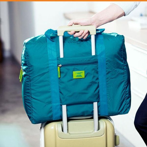 Um saco de armazenamento de viagens coreano, casa multi-funcional poliéster dobrável bag bags de bagagem