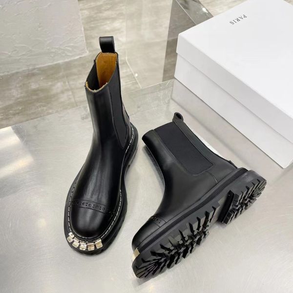 

black elasticated chunky platform biker ankle boots leather martin booties with notched sole heavy duty luxury designers brands shoes
