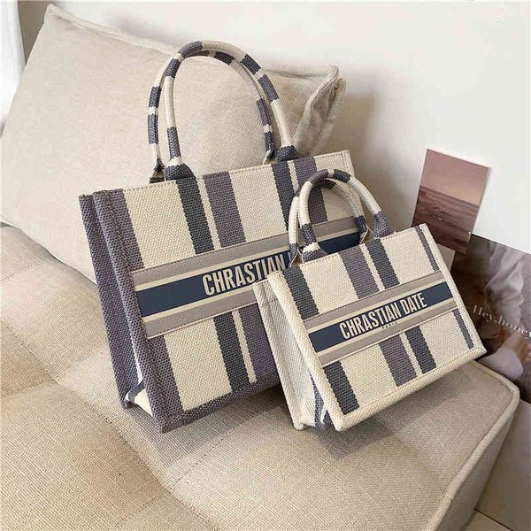 

textured striped canvas 2021 new contrast hand atmospheric shopping leisure tot women's bag