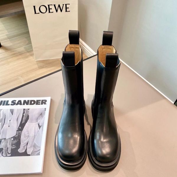 

boots round toe with a chunky tread sole rubber detailing comfortable elastic side panels and back loop soft genuine leather mid boot, Black