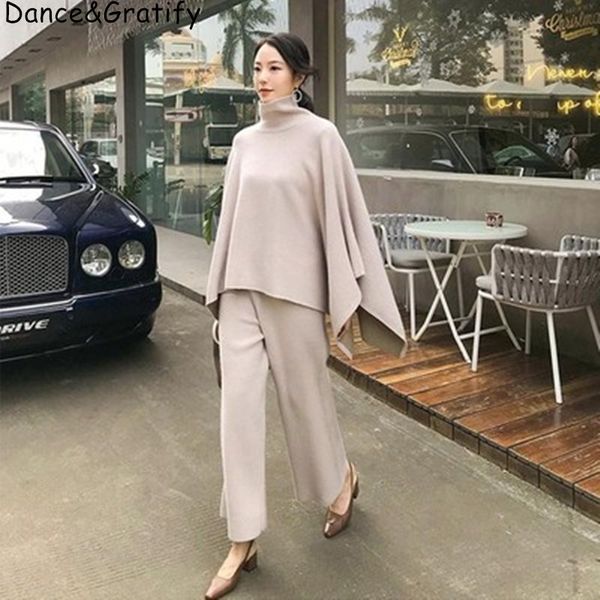 

women's two piece pants knitted or crocheted ensemble with a turtleneck and trousers, two pieces, loose ankle wool blend, autumn winte, White