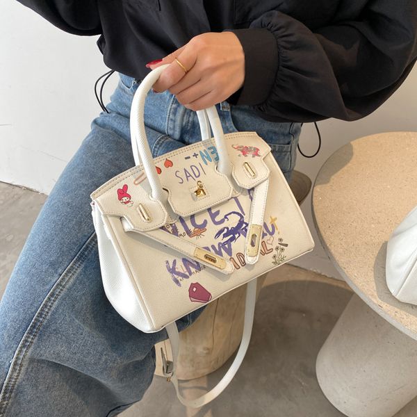 

luxury handbags women's 2021 new korean fashion hand-held graffiti women's net red texture large capacity messenger bag