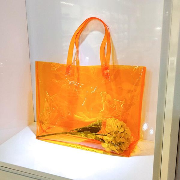 

storage bags large capacity clear tote bag, orange pvc shoulder handbag for women, stadium bag shopping, sports and work