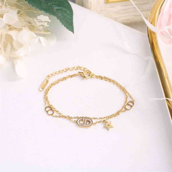 

special offer 2021 luxury designer jewelry display titanium steel korean letter fritillary hollow double thin chain is a bracelet delicate, White