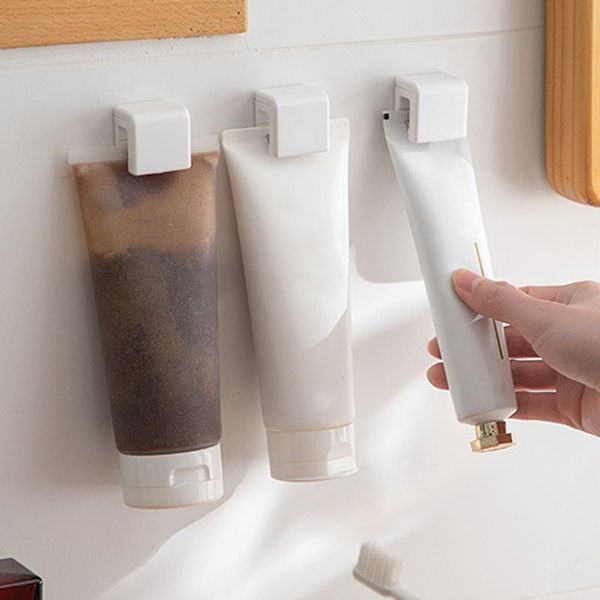 

hooks & rails self adhesive toothpaste rack hanging holder facial cleanser clip wall mount stand organizer bathroom accessories