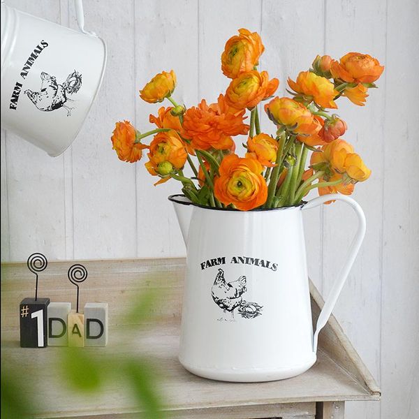 

farm style cream white handmade metal water can floral arrangement ideas