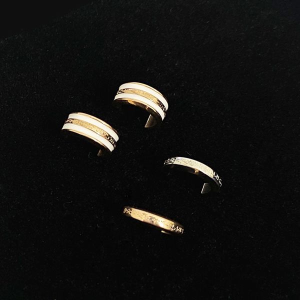 

new dw earrings women's white ceramic titanium steel couple simple personalized earclip men's net red same niche design, Golden