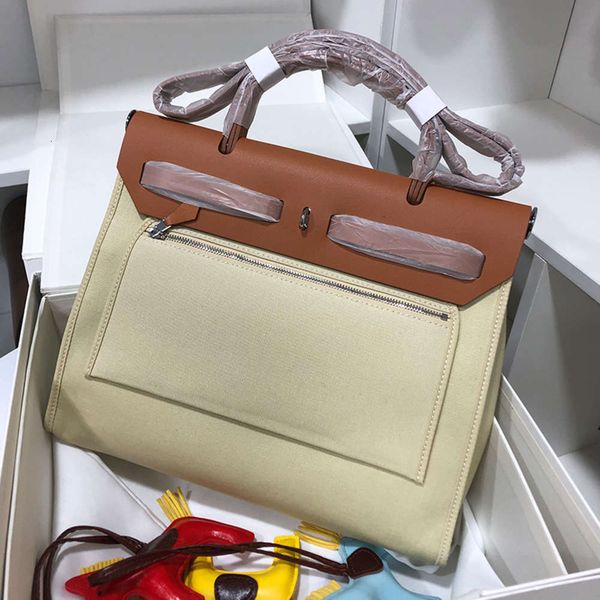 

women's 2021 new fashion leisure kelly cow leather splicing canvas portable one shoulder messenger bag