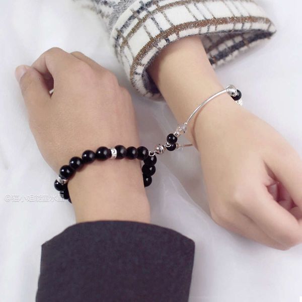 

a pair of pure silver token bracelets for men and women, Black