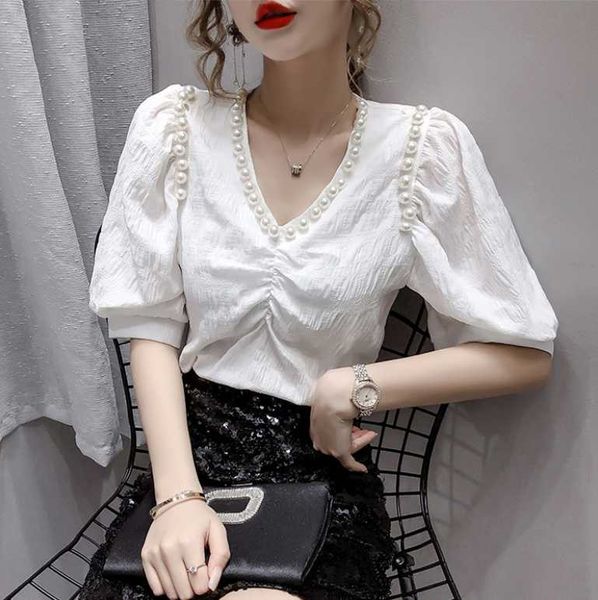 

2021 summer new korean version of the french niche pearl v-neck wild solid color bubble sleeve loose blouse women, White