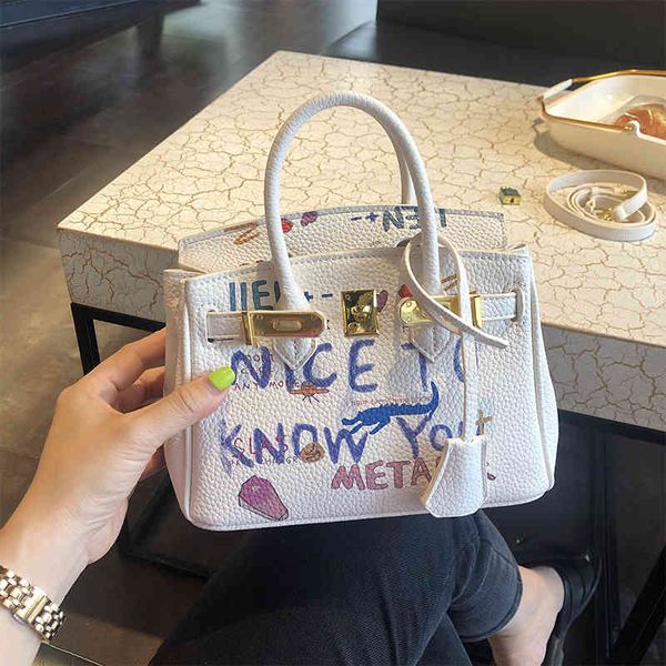 

graffiti hand 2021 new fashion versatile foreign style advanced women's mini kelly messenger bag