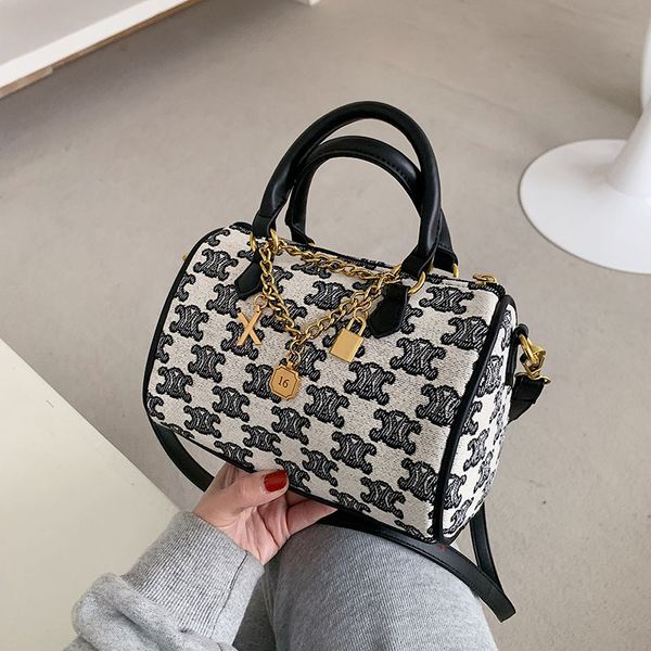 

new fashion canvas pillow hand printed letter shoulder popular metal pendant messenger bag