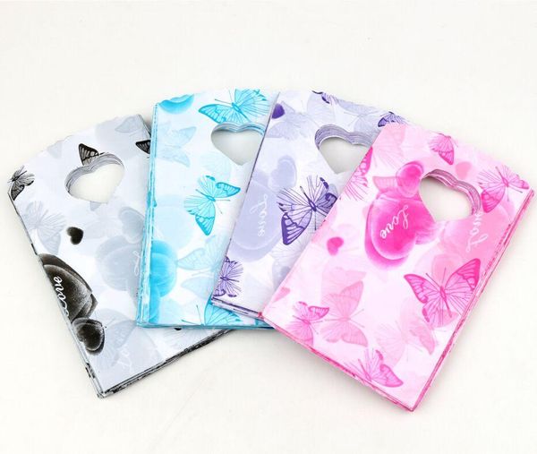 

2021 new 200pcs/lot 4colors 15x9cm heart and butterfly patterns plastic jewelry gift bag jewelry pouches bags, Pink;blue
