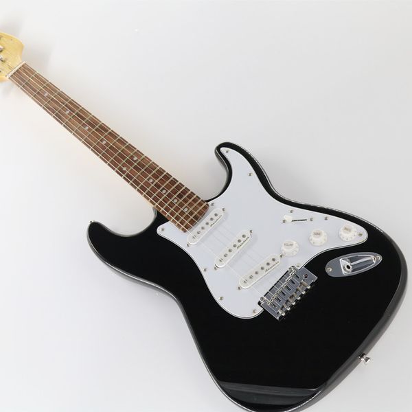 

black shiny electric guitar, rosewood ffngerboard,