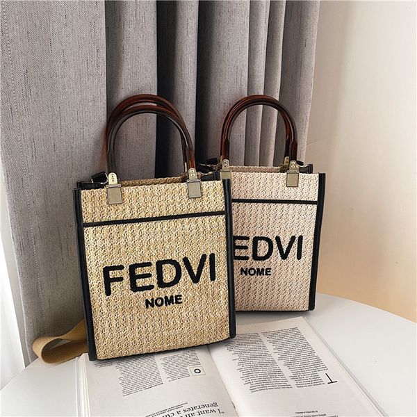 

design hand fenjia's new hand-held acrylic is versatile and fashionable, with one shoulder slung straw woven bag letters, Red;black