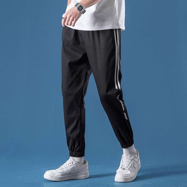 

2021 spring wear men's new casual pants stripe fashion student sports pants slim fit small leg capriswinter, Black