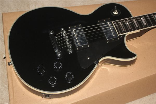 

customized black gloss electric guitar with ebony fretboard and fret binding