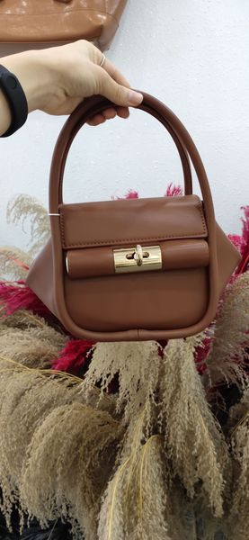 

korean special-interest design gu_de cowhide niche ingot bag dumpling bag hand carrying messenger bag