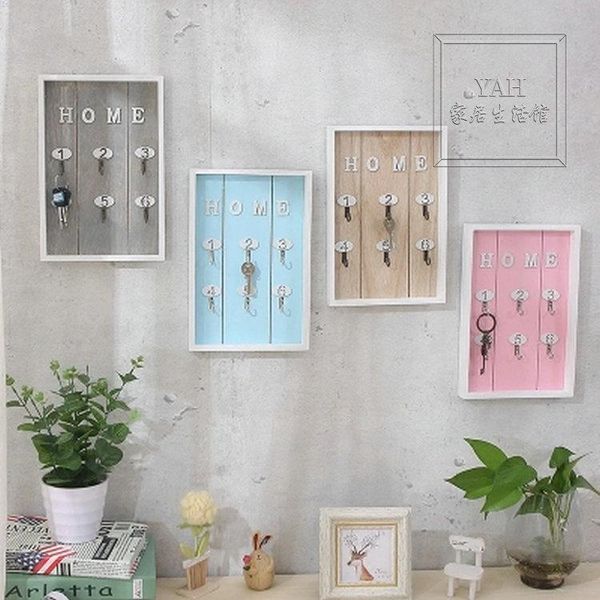

on the shoe cabinet on the wall, key storage box is hung wall