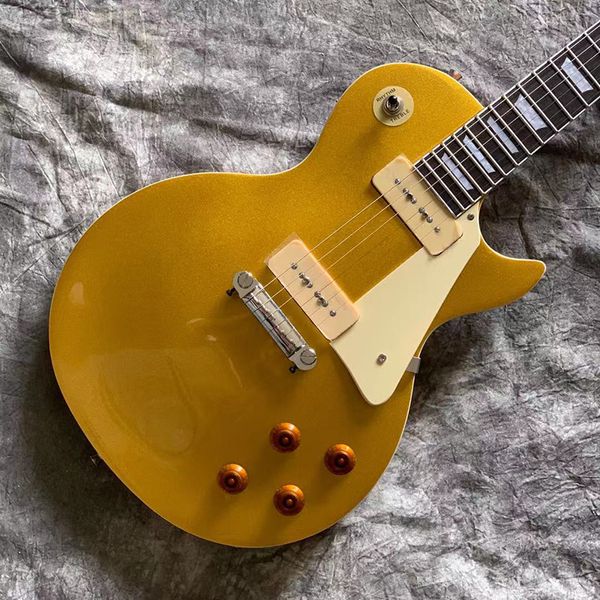 

a golden lp electric guitar with exquisite appearance, thick and elastic sound, of transportation fee and delivered to home