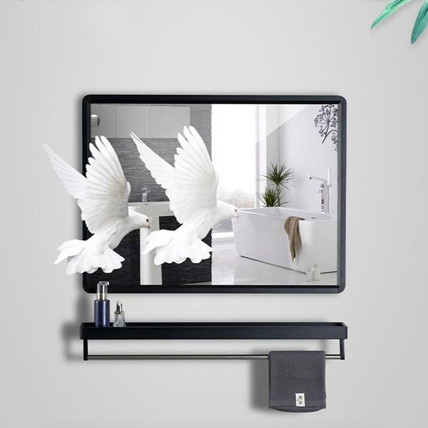 

mirrors bathroom mirror is attached to the wall without drilling