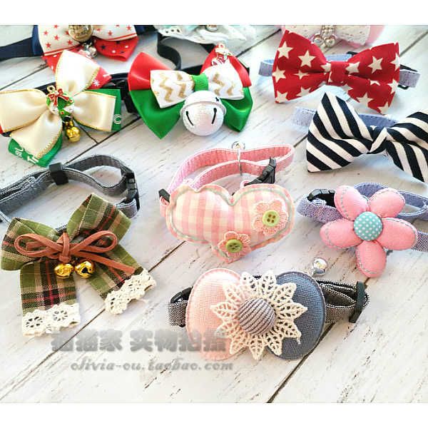 

a variety of bows, dog bells, cat necks, pet neckties, teddy necklaces, hanging accessories