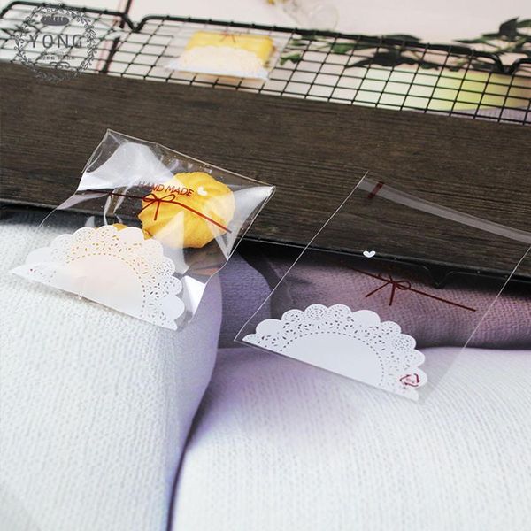 

sktn 100pcs lace bow print cartoon cookie&candy bag self-adhesive plastic bags for biscuits snack baking package supplies