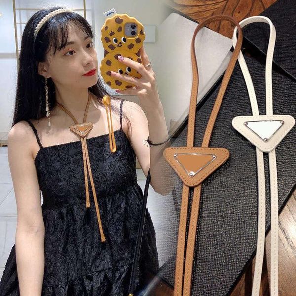 

black triangle label lgo men's and women's fashion, leather bow tie pattern, letter necklace clothing fur, solid color free, Red;brown