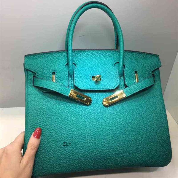 

fashionable bag with litchi pattern and cow leather lake green hand bill of lading bagszlyzly