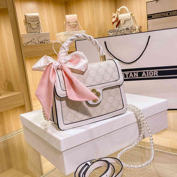 

2022 factory outlet online women's style buckle portable small square red texture women's embossed letter messenger bag