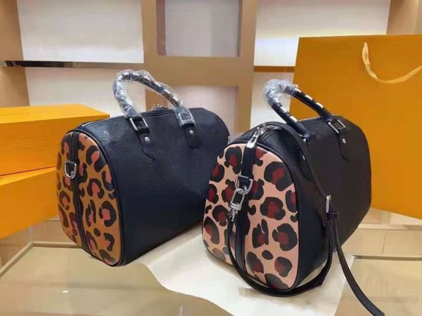 

classic diagonal bag, handbag. black calf print with brown leopard print.