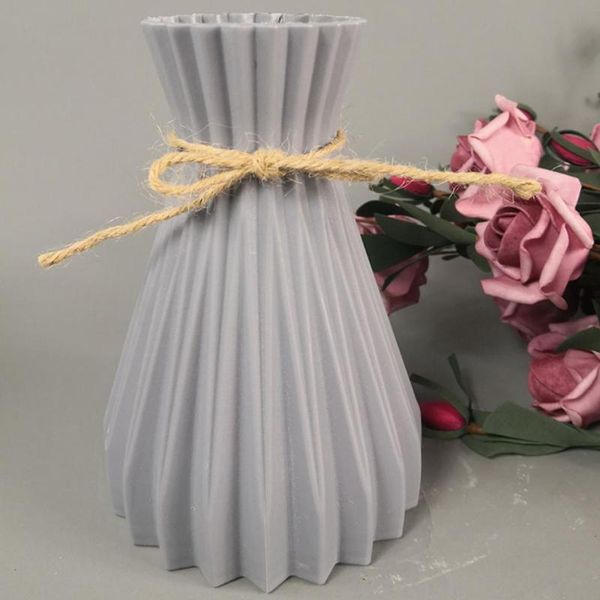 

white rattan-like plastic vase for flower arrangement vases without flower