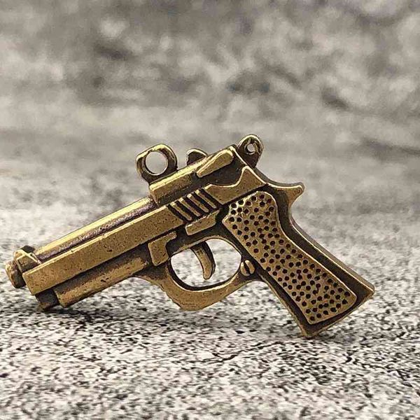 

brass key chain brass pendant small object night market pistol