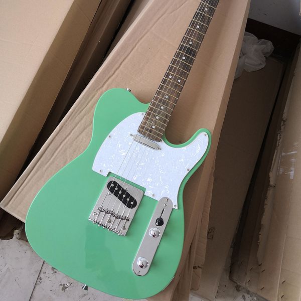 

6 strings green electric guitar with white pearled pickguard