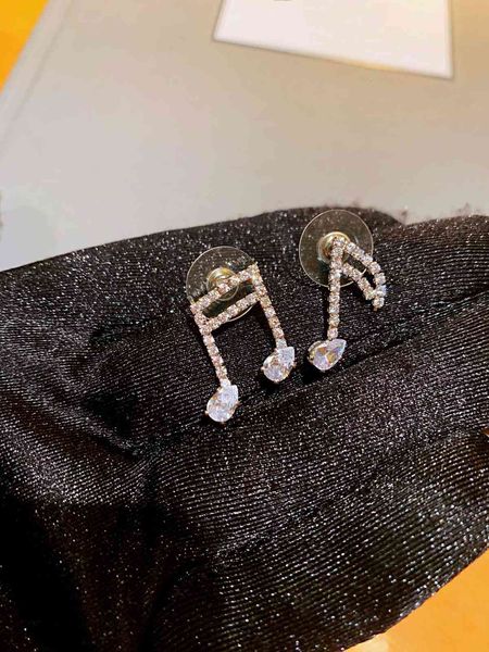 

earrings di jia stud d caibao note with s925 silver, Golden;silver