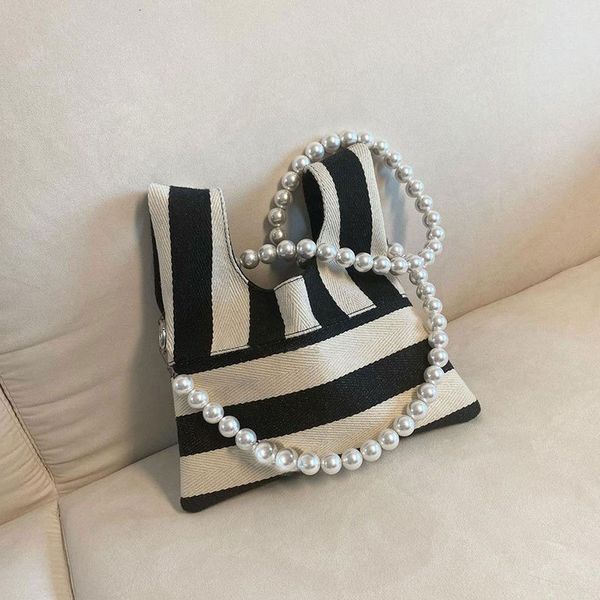 

korean xiaozhongchao brand same bag striped knitted single shoulder 2021 new pearl chain messenger