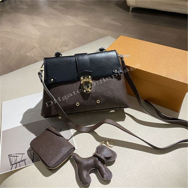

artwork perforated women luxurys designers bags 2021 locks package zero wallet dog accessory pendant cross body famous fashion cross-body