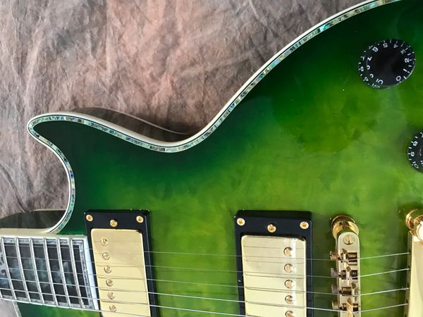 

custom lp electric guitar building color a flame maple gold hardware inlays flowers color green