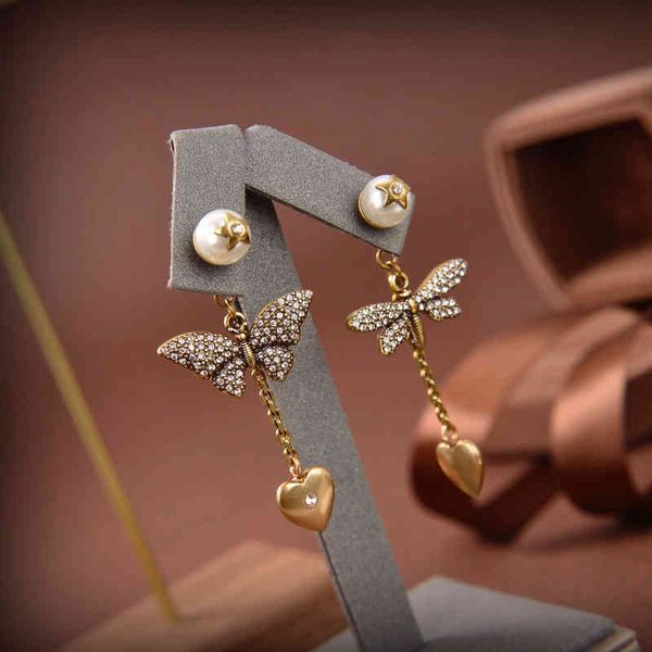 

2022 latest factory wholesale personality brass medium length bow earrings, Golden