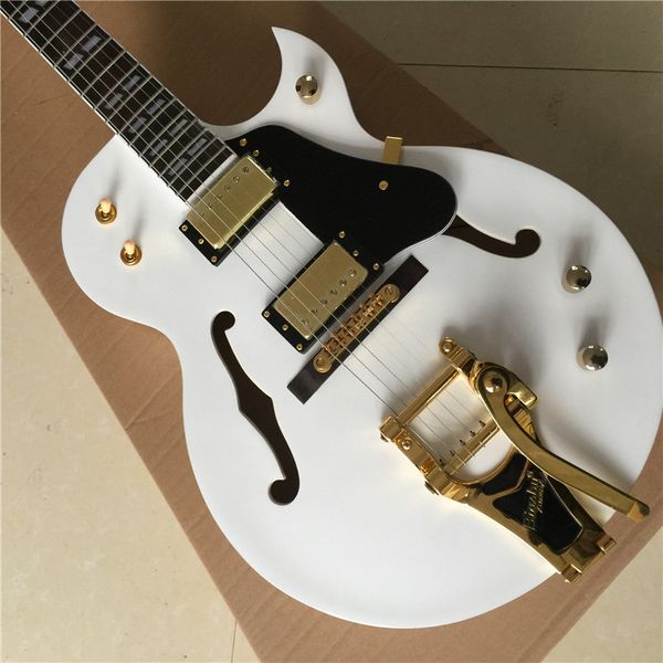 

jazz electric guitar, white, hollow body, gold hardware, hot