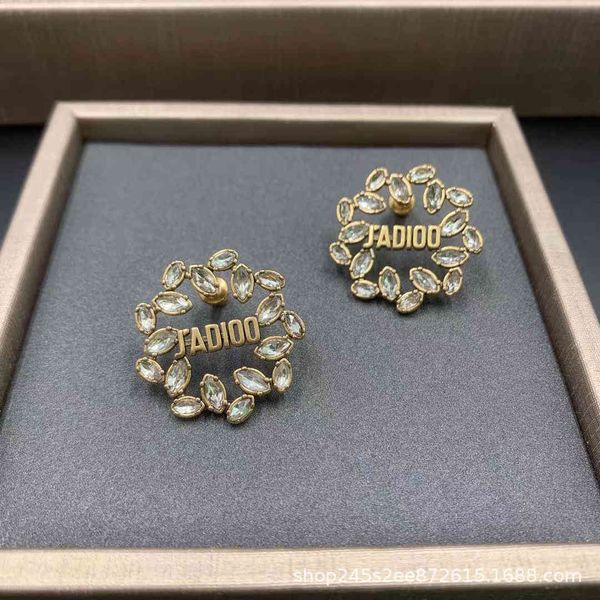 

flower earrings female pearl inlaid brick light luxury star net red same live silver needle 2021