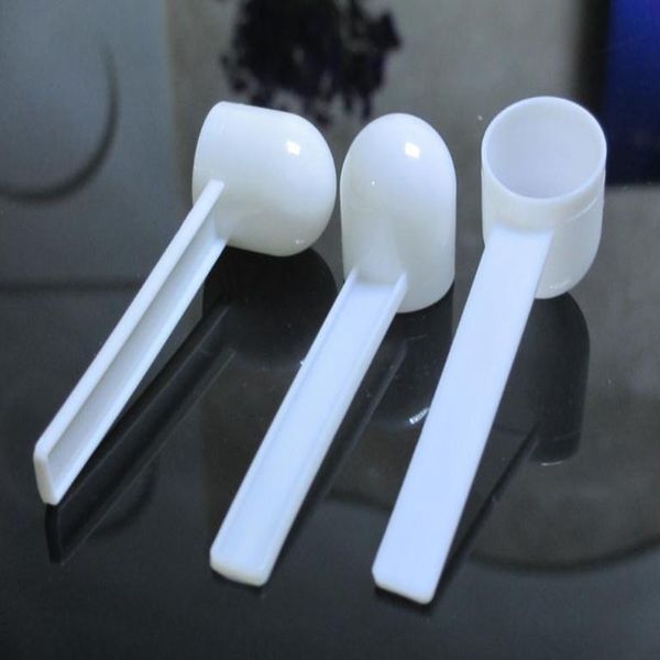 Moda professionale in plastica bianca 5 grammi 5G cucchiai cucchiai per cibo latte detersivo in polvere medicina misura 8,5 * 2,6 cm