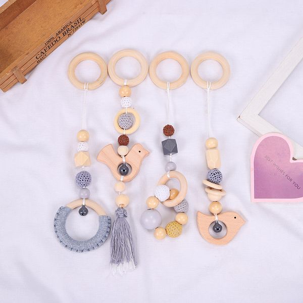 

4 pcs/set baby gym frame stroller hanging pendants wooden ring teether molar teething nursing rattle toys infant room decoration 2500 q2