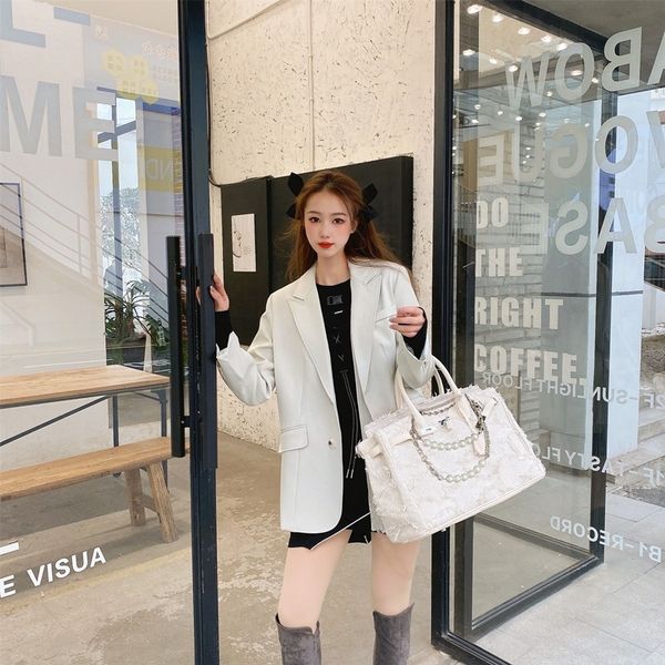 

japanese niche women's 40 canvas denim portable beggar tassel bag spring new style