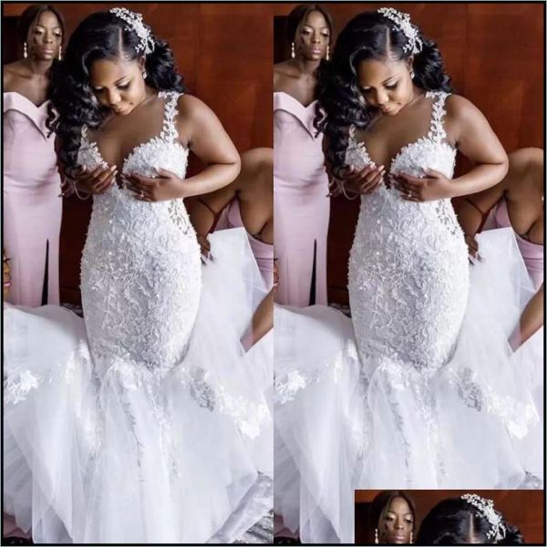 

2022 african mermaid wedding dresses sleeveless lace applique sweep train jewel neck covered buttons back wedding gown vestido de novia, White