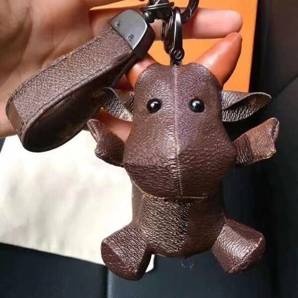 

2021 cattle keychains year of the ox with letters pattern keychain fashion bags doll chains for wholesale unisex, Silver
