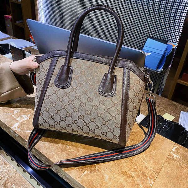 

2022 factory wholesale bag fashion korean version ins shell hand women's cross carrying one shoulder canvas smiling bag