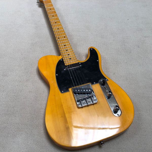 

6-string electric guitar, black guard, maple