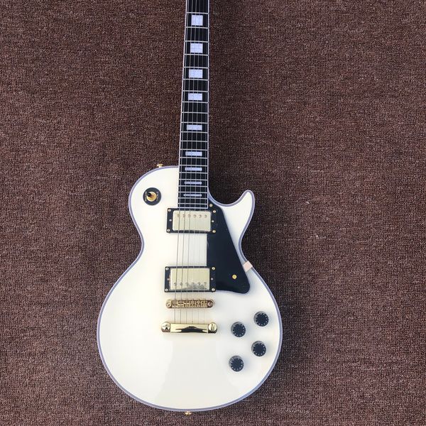 

electric guitar,rosewood fingerboard,gold hardware,cream colour